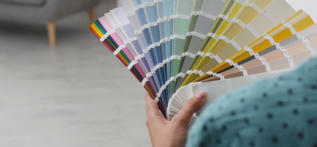 interior designer holding paint sample book